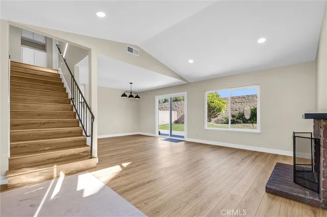 a view of an entryway with wooden floor