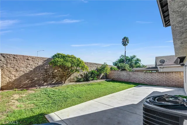 a view of a backyard with sitting area