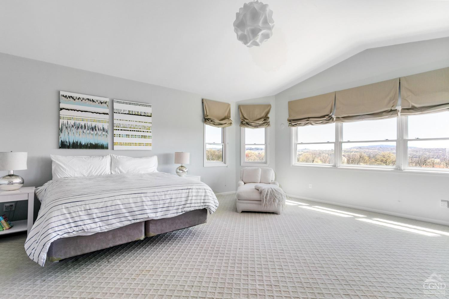 742 Embought Road Catskill, NY 12414 - Photo 12 of 32 a bedroom with a bed and a large window