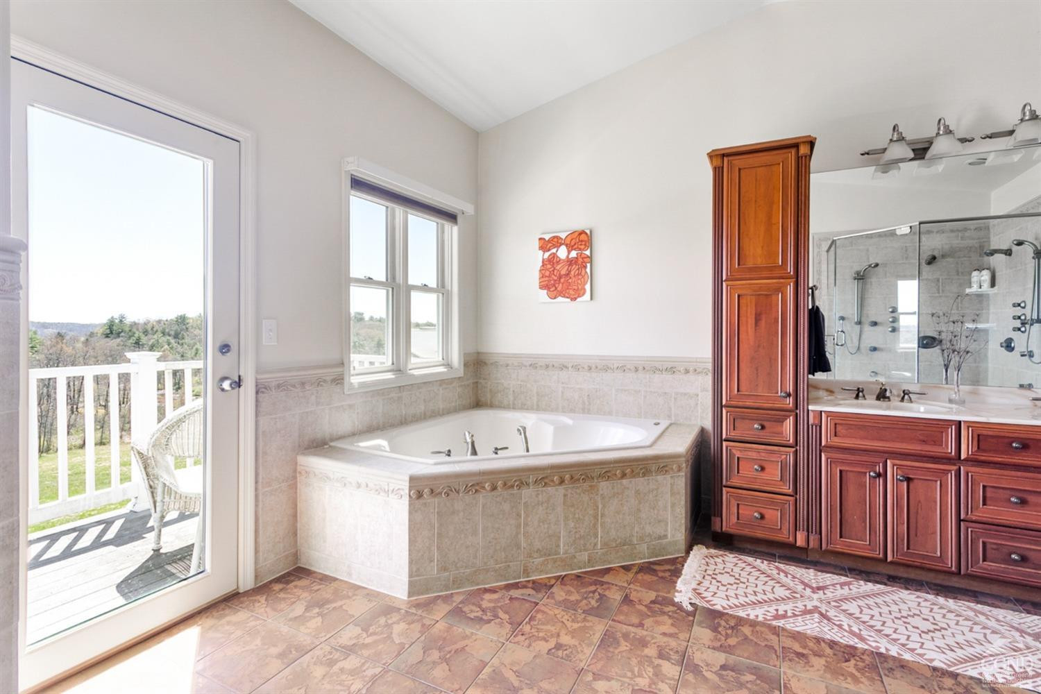 742 Embought Road Catskill, NY 12414 - Photo 13 of 32 a spacious bathroom with a tub sink and mirror