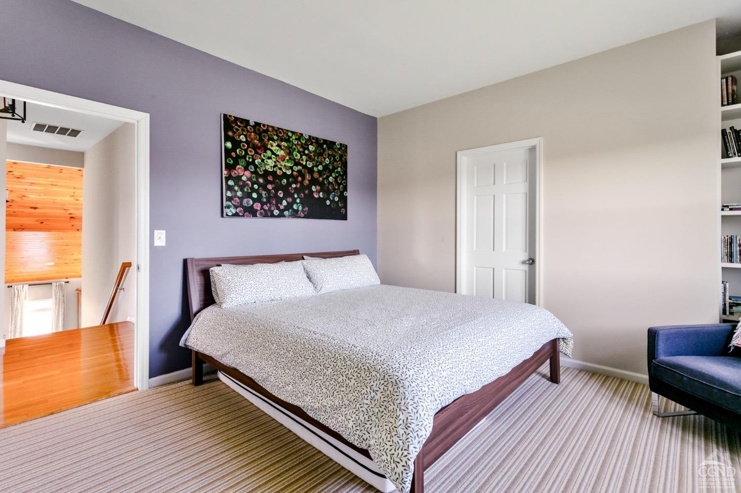 742 Embought Road Catskill, NY 12414 - Photo 15 of 32 a bedroom with a bed and wooden floor