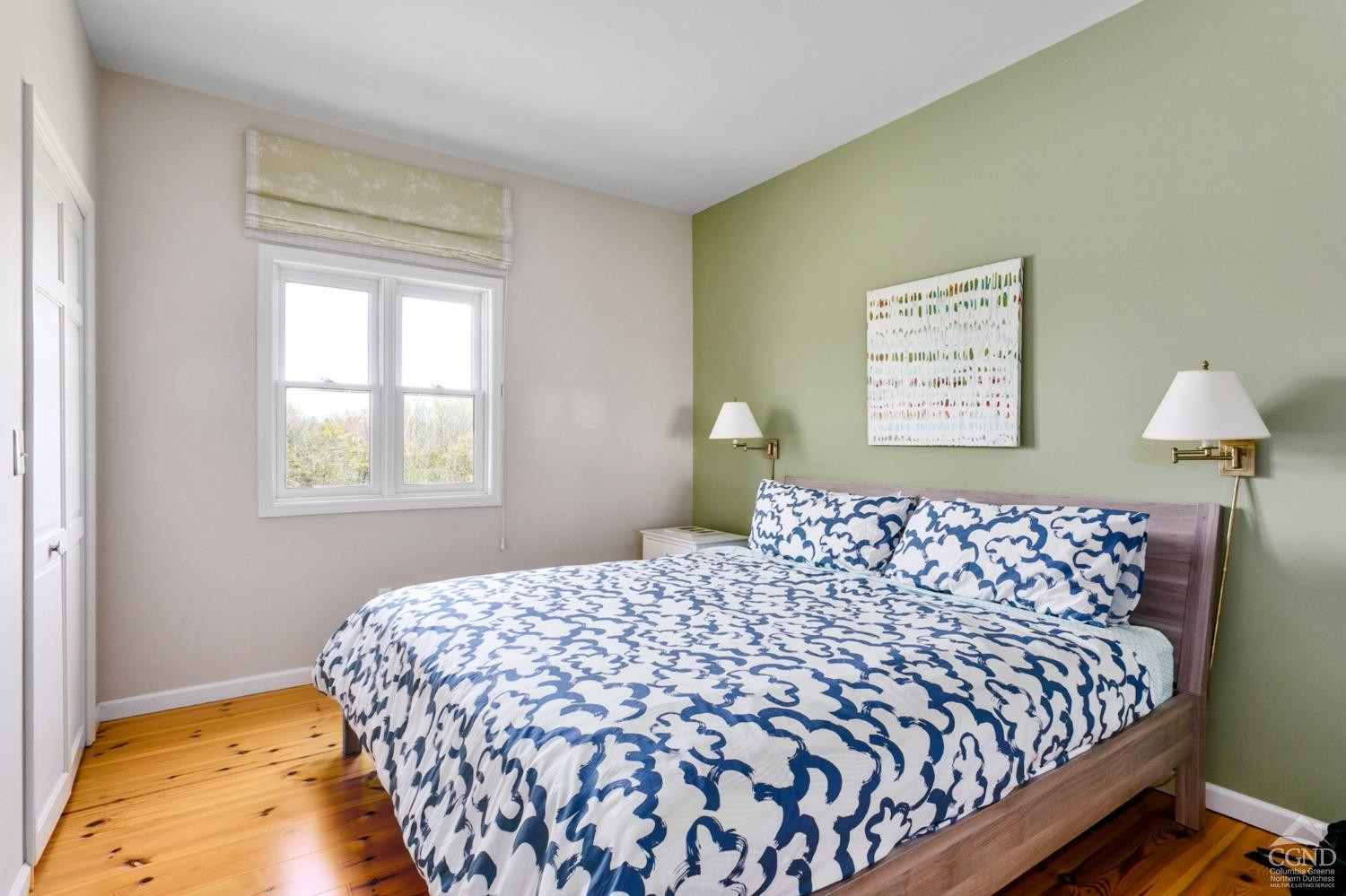 742 Embought Road Catskill, NY 12414 - Photo 18 of 32 a bedroom with a bed and a window