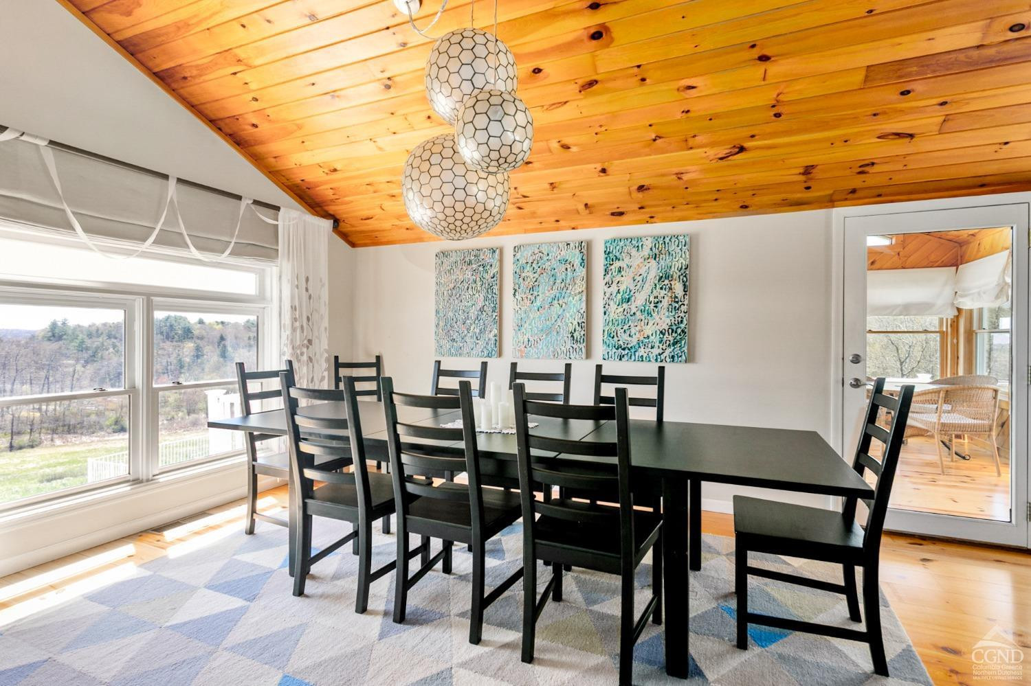 742 Embought Road Catskill, NY 12414 - Photo 9 of 32 a view of a dining room with furniture and wooden floor