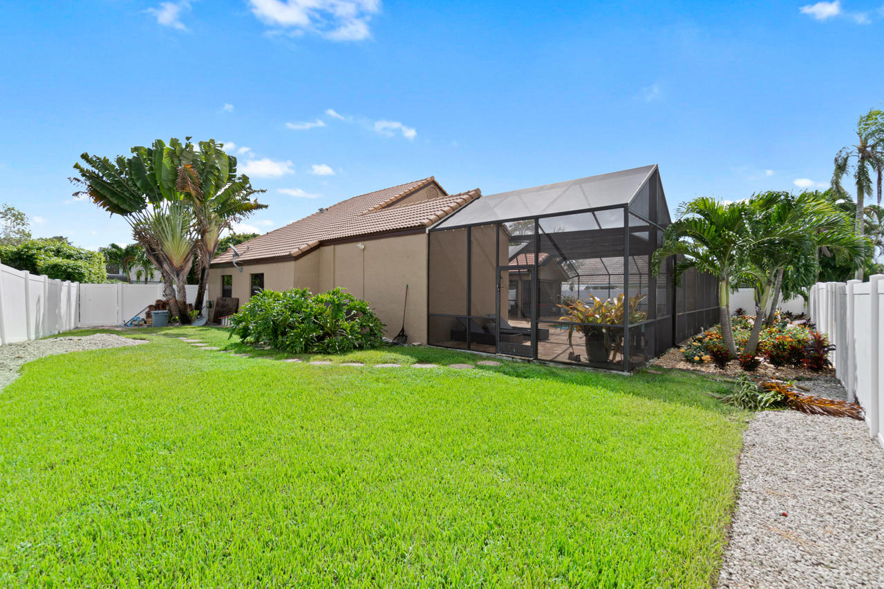 22313 Ensenada Way Boca Raton, FL 33433 - Photo 21 of 44 a view of a house with backyard and porch