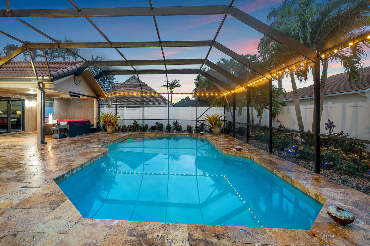 22313 Ensenada Way Boca Raton, FL 33433 - Photo 23 of 44 a view of a swimming pool with a patio