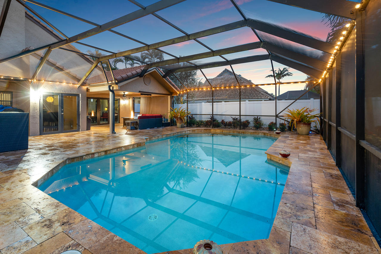 22313 Ensenada Way Boca Raton, FL 33433 - Photo 24 of 44 a view of a swimming pool with a patio