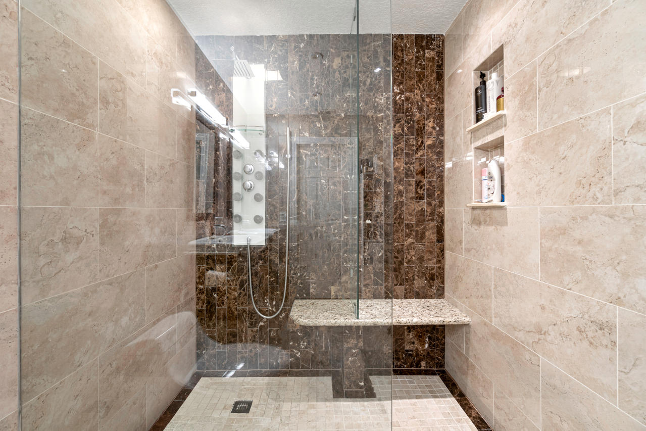 22313 Ensenada Way Boca Raton, FL 33433 - Photo 32 of 44 a bathroom with a bathtub and shower