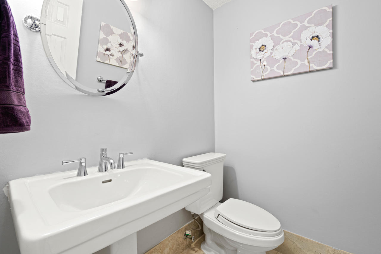 22313 Ensenada Way Boca Raton, FL 33433 - Photo 35 of 44 a white toilet sitting next to a white sink