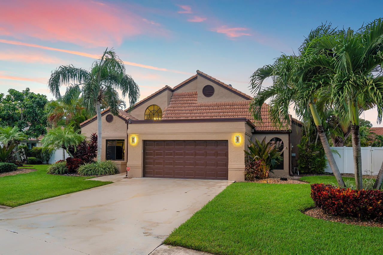 22313 Ensenada Way Boca Raton, FL 33433 - Photo 38 of 44 a front view of a house with a garden