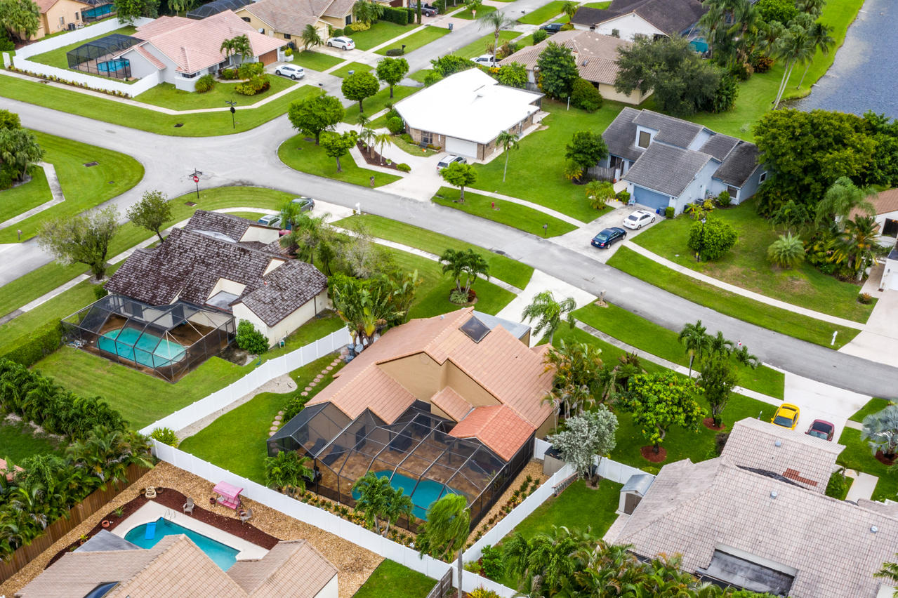 22313 Ensenada Way Boca Raton, FL 33433 - Photo 42 of 44 an aerial view of a house with a garden and lake view