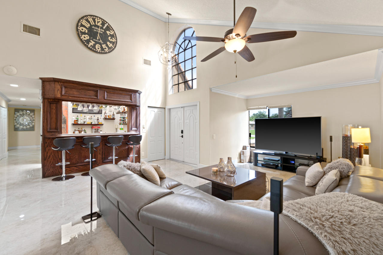 22313 Ensenada Way Boca Raton, FL 33433 - Photo 5 of 44 a living room with furniture and a flat screen tv