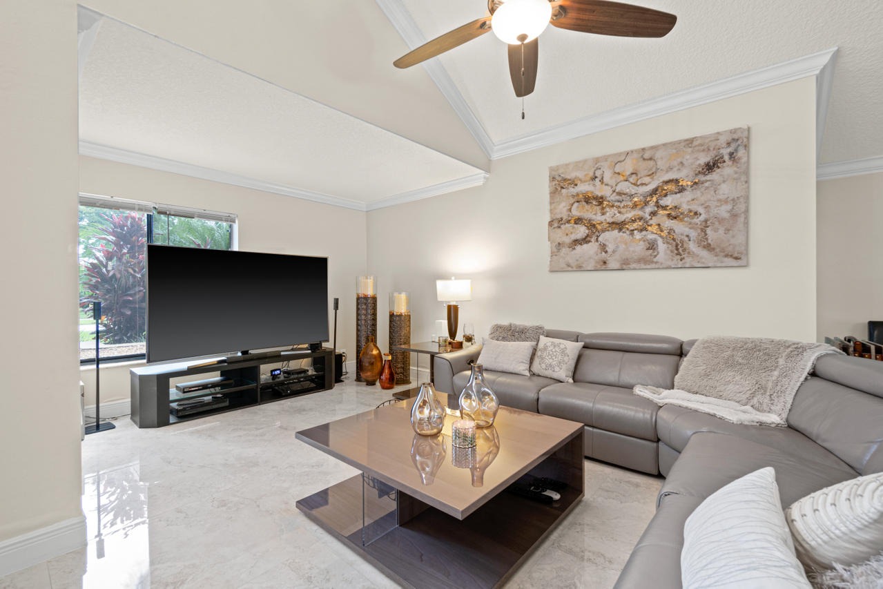 22313 Ensenada Way Boca Raton, FL 33433 - Photo 7 of 44 a living room with furniture and a flat screen tv