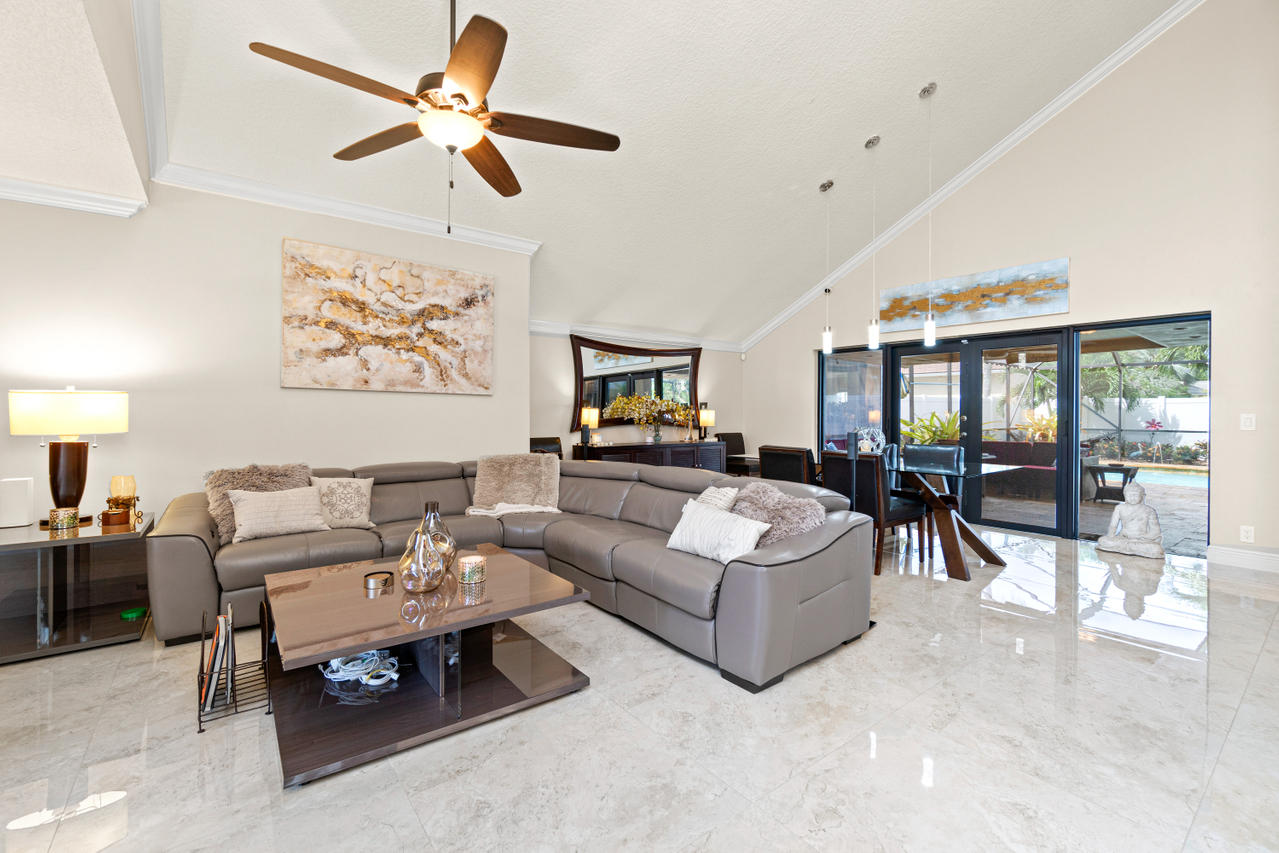 22313 Ensenada Way Boca Raton, FL 33433 - Photo 8 of 44 a living room with furniture and a view of kitchen