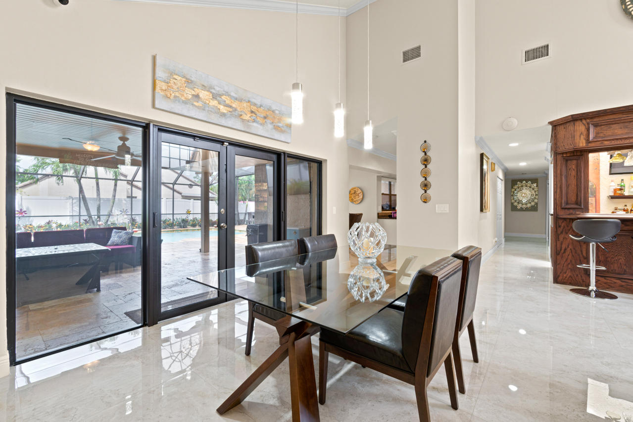 22313 Ensenada Way Boca Raton, FL 33433 - Photo 10 of 44 a view of a dining room with furniture window and outside view