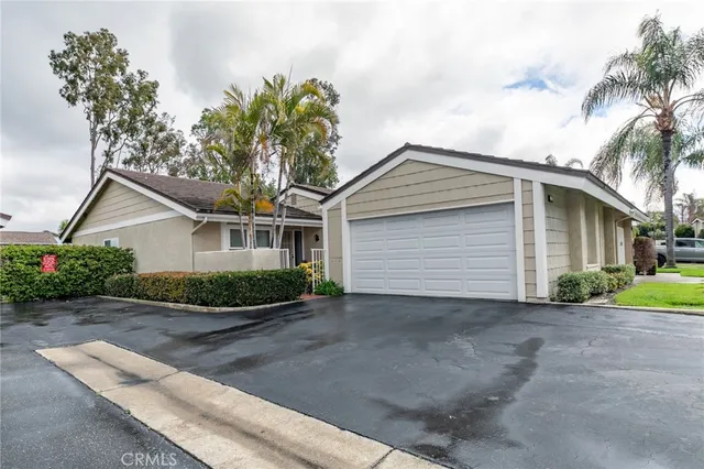 a front view of house with garage and yard