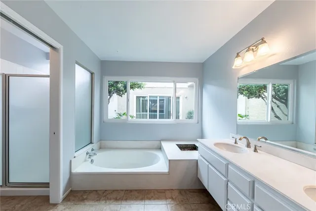 a bathroom with a bathtub and a sink
