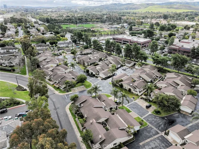 an aerial view of residential houses with outdoor space