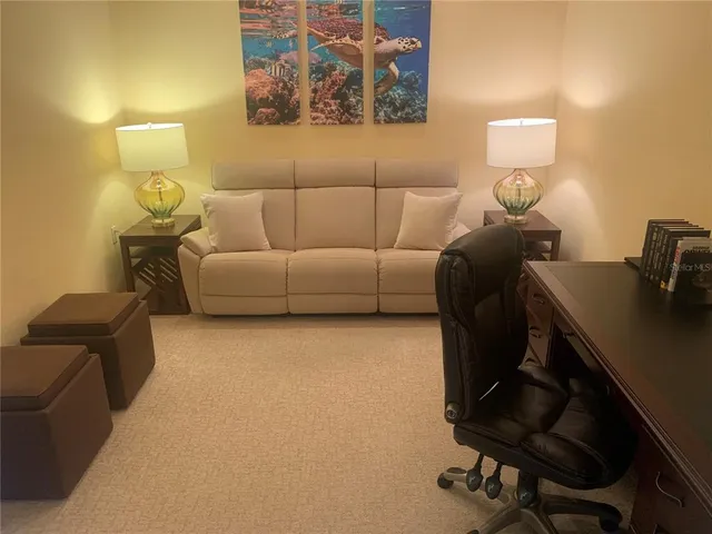 a bedroom with a bed and a chair