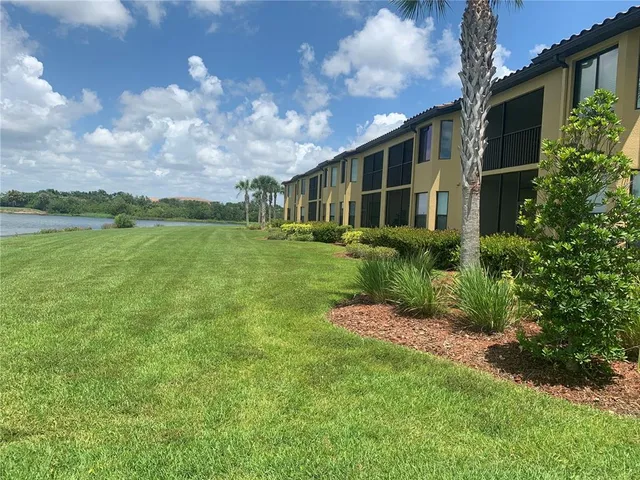 a front view of house with yard and trees