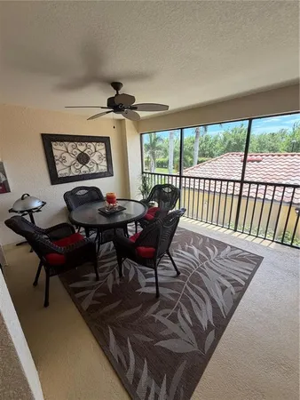 a living room with furniture and a large mirror