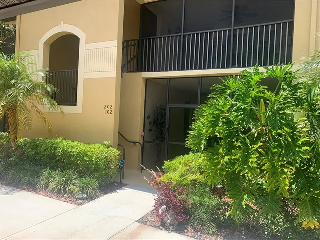 a side view of a house with a garden