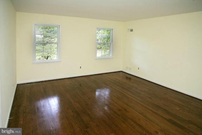 7912 Greentree Road Bethesda, MD 20817 - Photo 13 of 23 a view of room with wooden floor and window