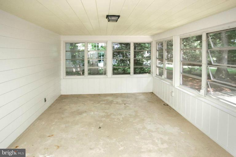 7912 Greentree Road Bethesda, MD 20817 - Photo 18 of 23 an empty room with an outdoor view