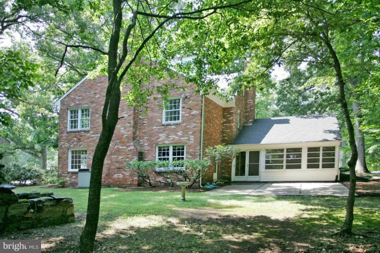 7912 Greentree Road Bethesda, MD 20817 - Photo 20 of 23 a front view of a house with a yard