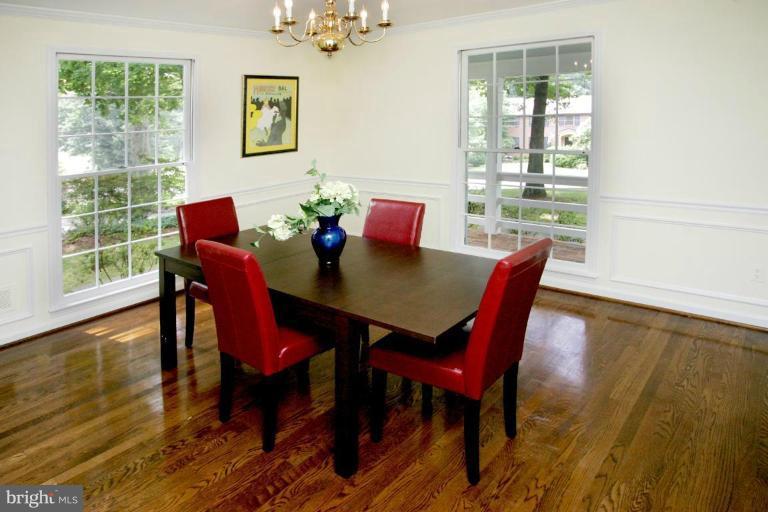 7912 Greentree Road Bethesda, MD 20817 - Photo 6 of 23 a view of a dining room with furniture and wooden floor
