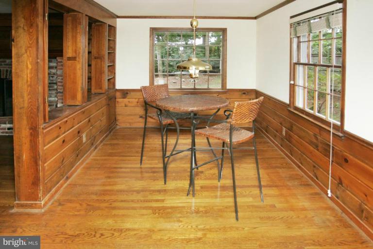 7912 Greentree Road Bethesda, MD 20817 - Photo 8 of 23 a dining room with furniture and wooden floor