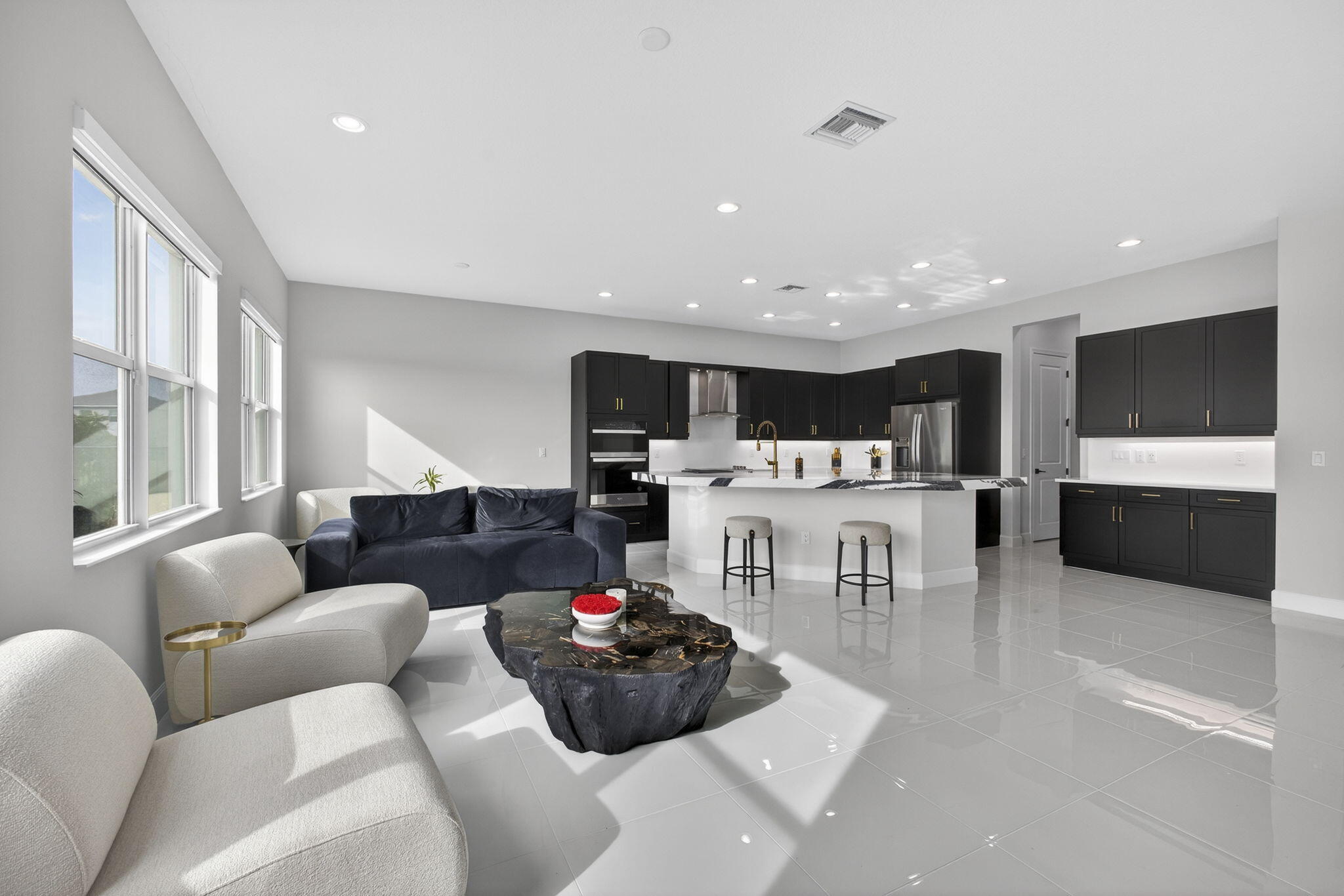 14052 Spruce Pne Drive Loxahatchee, FL 33470 - Photo 11 of 59 a living room with furniture and a flat screen tv