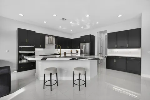 a kitchen with counter top space cabinets and stainless steel appliances