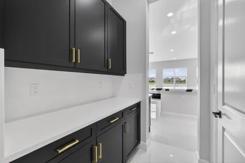 a kitchen with a refrigerator and cabinets