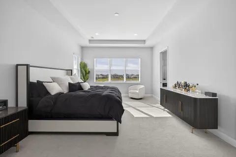 a bedroom with a bed and a dresser