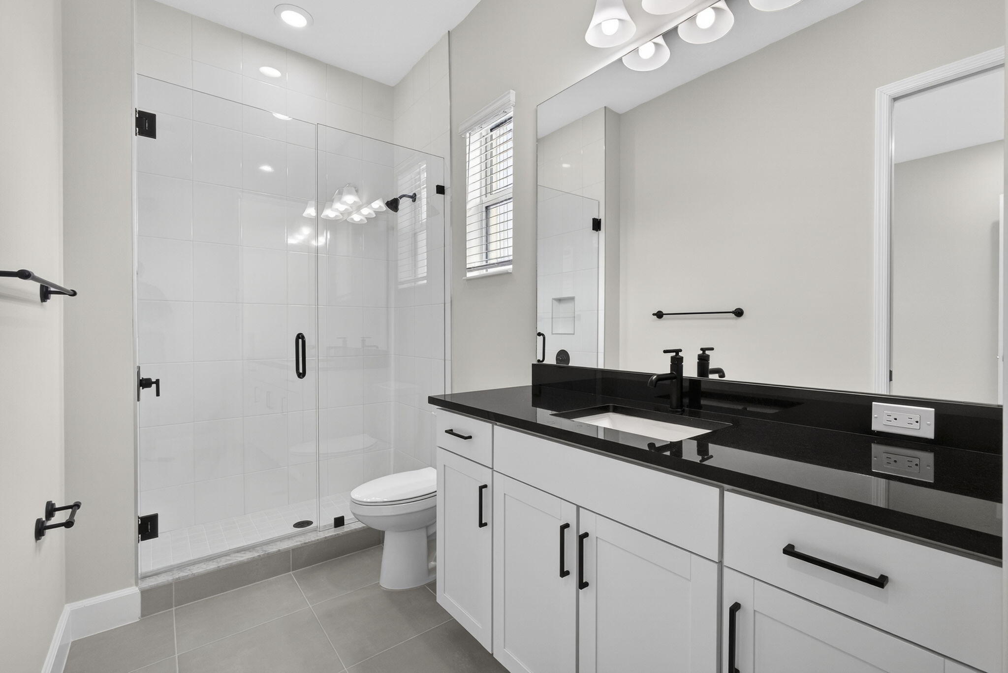 14052 Spruce Pne Drive Loxahatchee, FL 33470 - Photo 36 of 59 a bathroom with a granite countertop sink a toilet a large mirror and shower