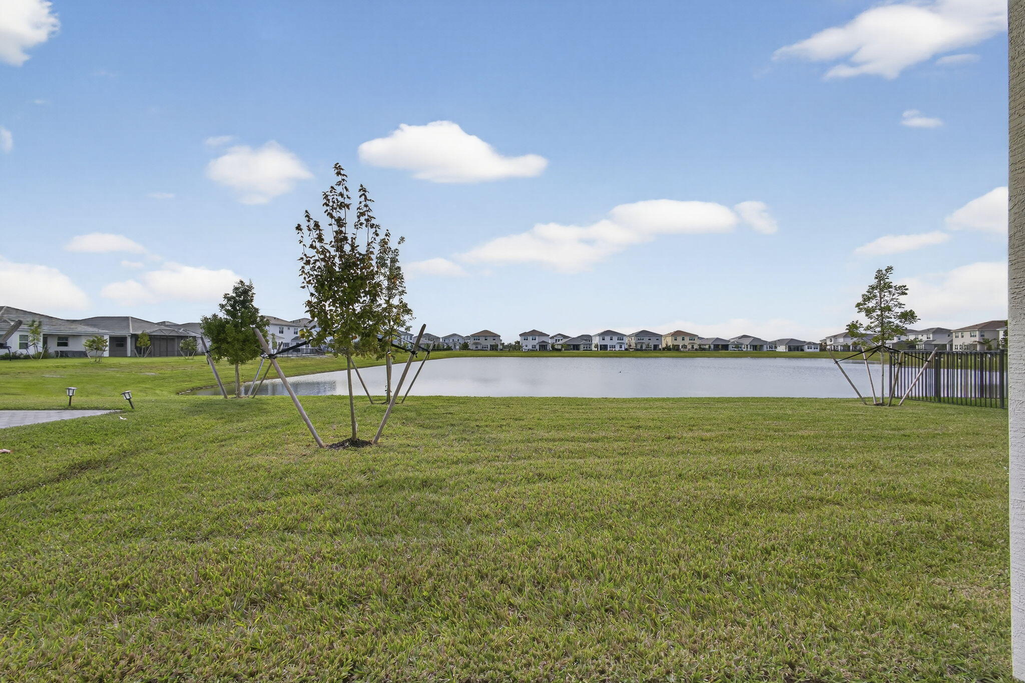 14052 Spruce Pne Drive Loxahatchee, FL 33470 - Photo 39 of 59 a view of a golf course with a lake