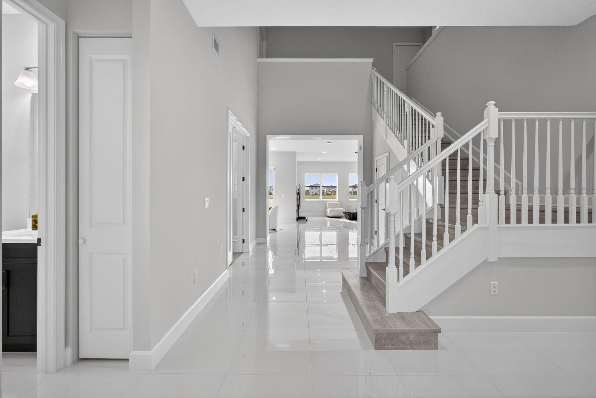 14052 Spruce Pne Drive Loxahatchee, FL 33470 - Photo 4 of 59 a view of a hallway with wooden floor and entryway