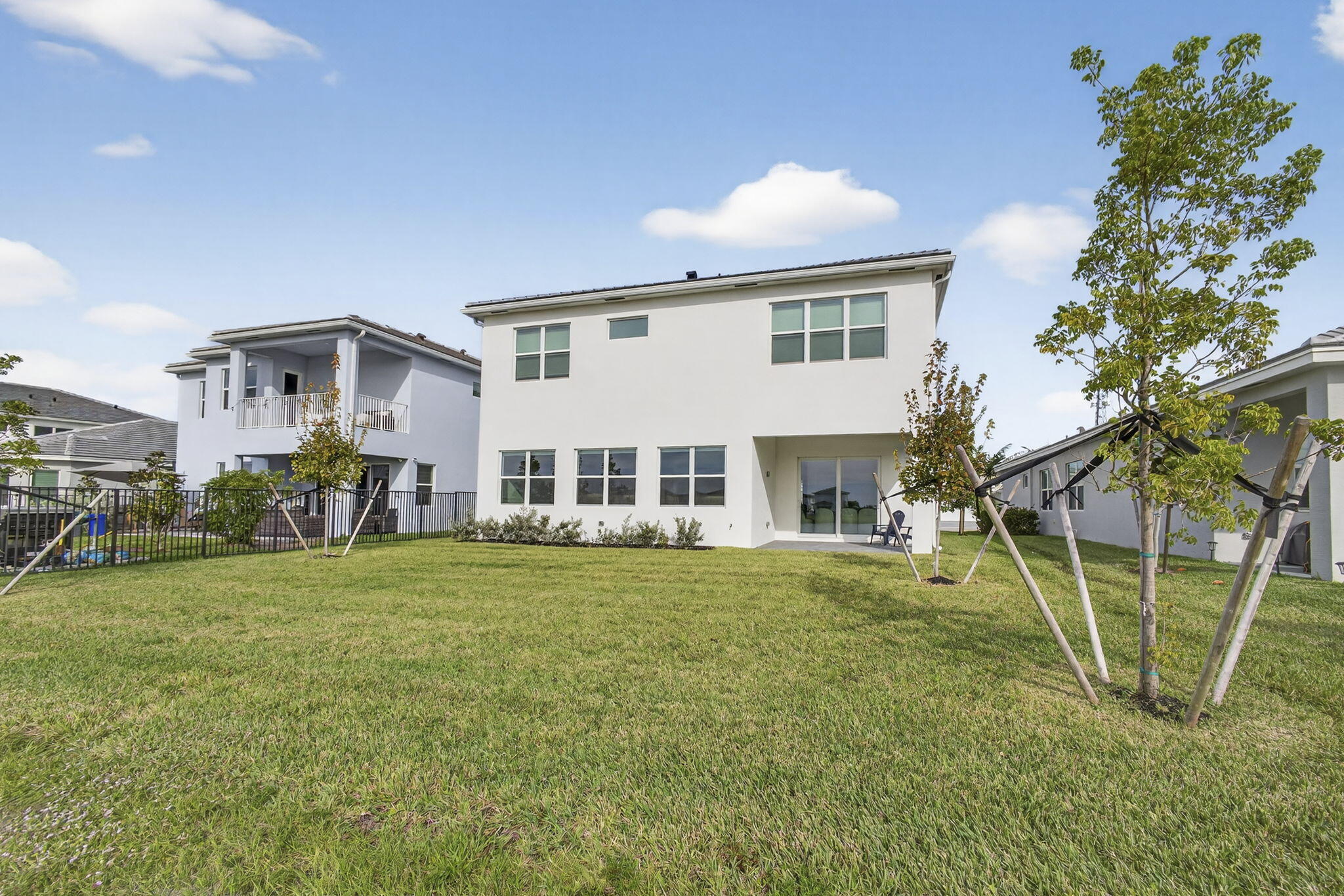 14052 Spruce Pne Drive Loxahatchee, FL 33470 - Photo 41 of 59 a view of a house with a backyard