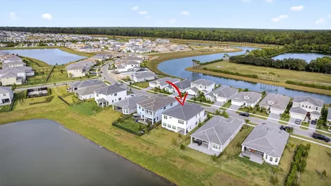 a view of a swimming pool with outdoor seating