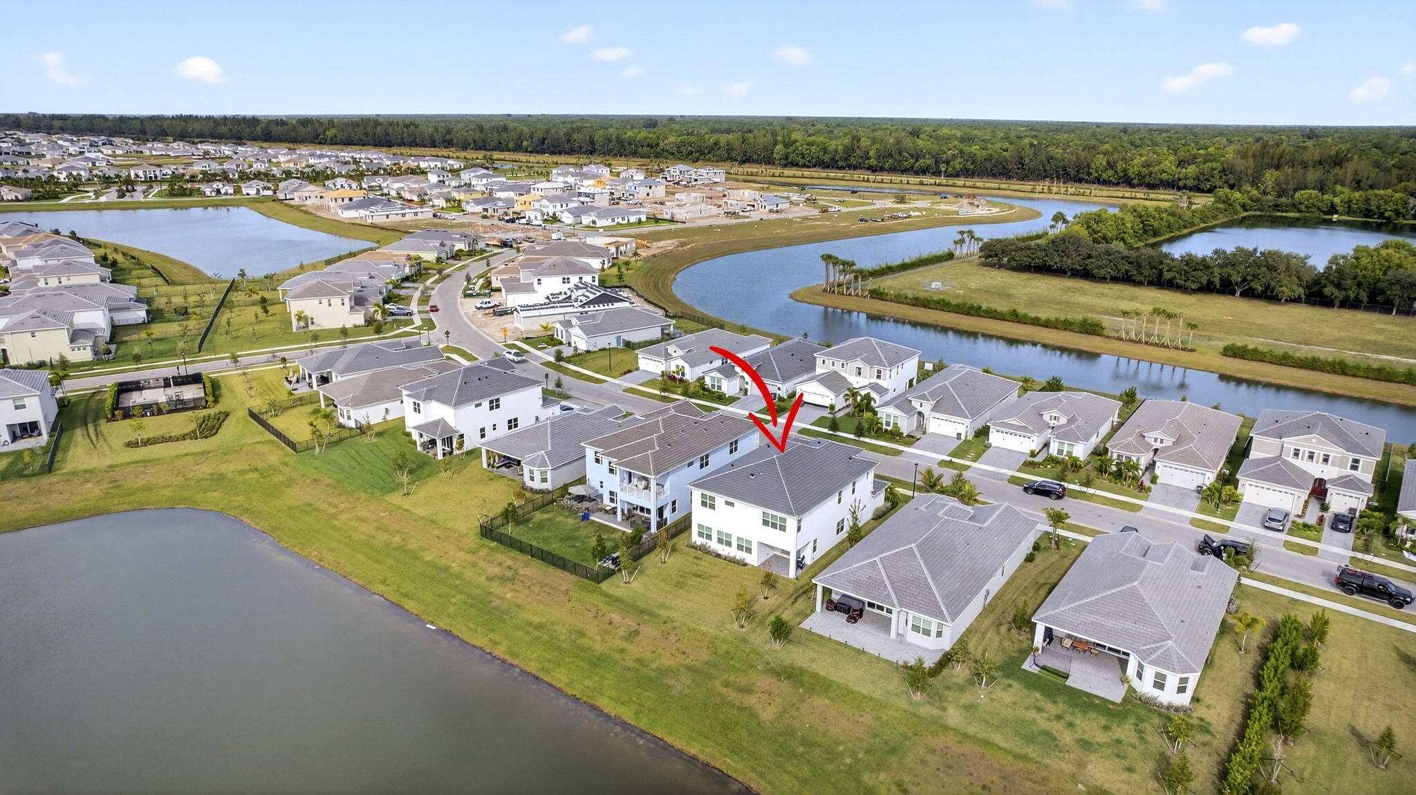 14052 Spruce Pne Drive Loxahatchee, FL 33470 - Photo 47 of 59 an aerial view of residential houses with outdoor space and lake view