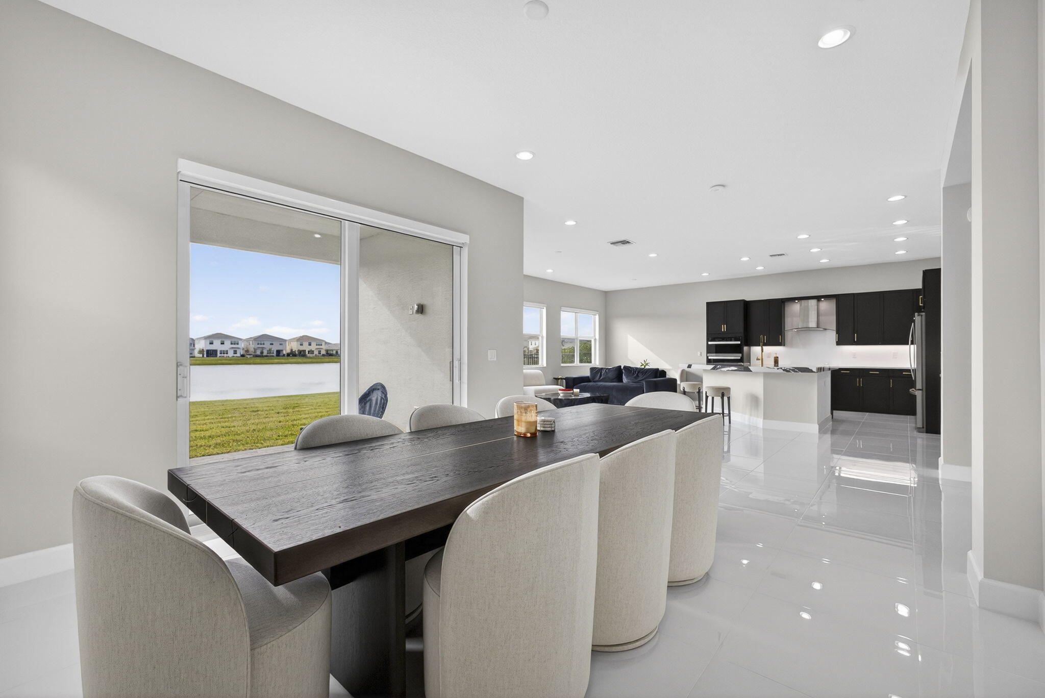 14052 Spruce Pne Drive Loxahatchee, FL 33470 - Photo 10 of 59 a large kitchen with a table and chairs