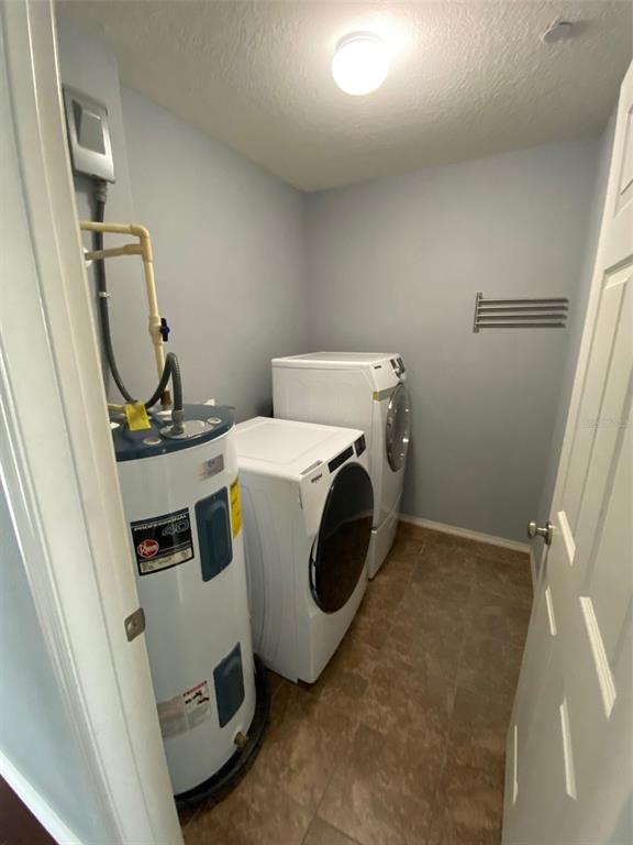 8946 White Sage Loop Lakewood Ranch, FL 34202 - Photo 32 of 36 a utility room with dryer and washer