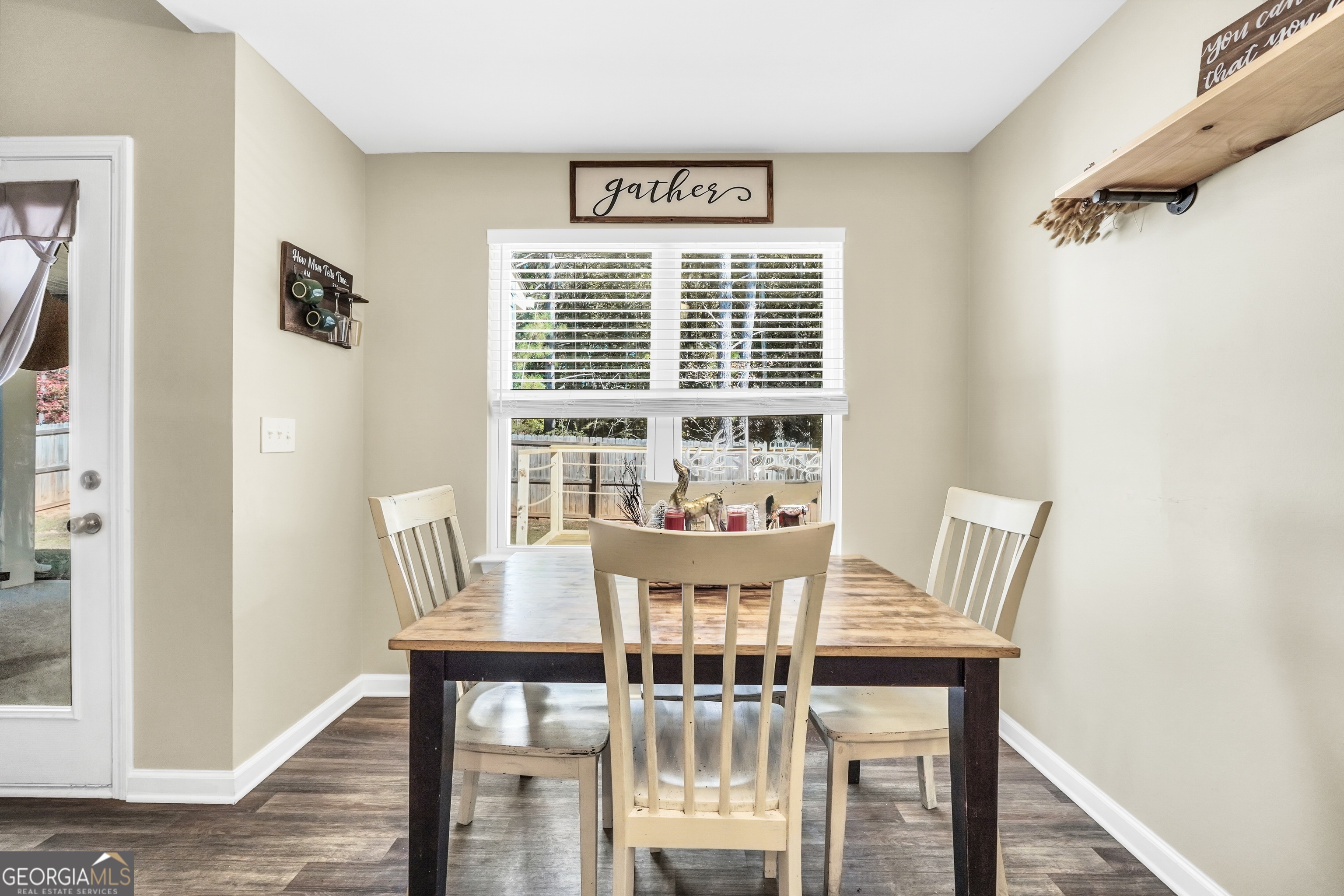 129 Magnolia Trail Milner, GA 30257 - Photo 11 of 29 a view of a dining room with furniture window and wooden floor