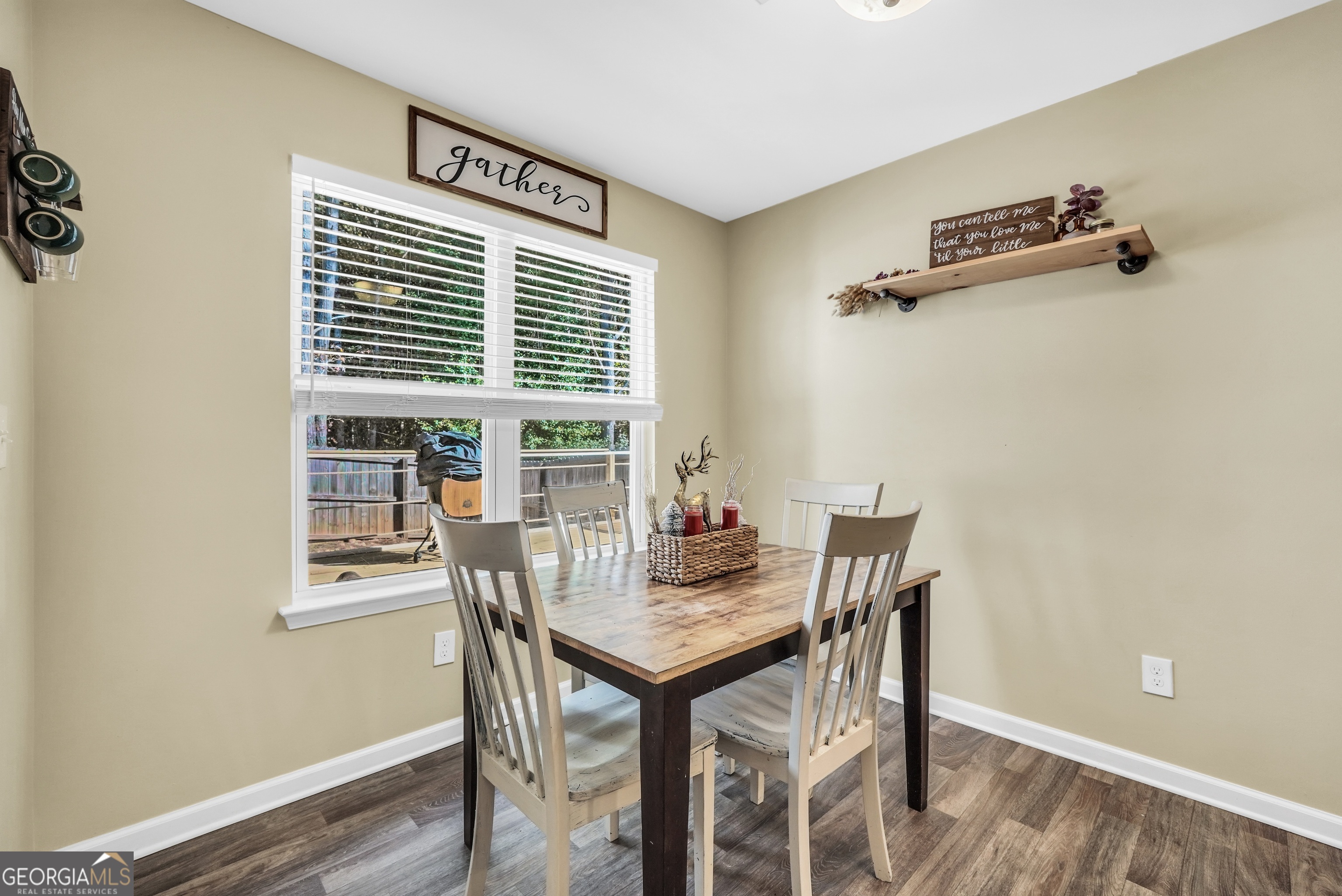 129 Magnolia Trail Milner, GA 30257 - Photo 12 of 29 a view of a dining room with furniture window and wooden floor