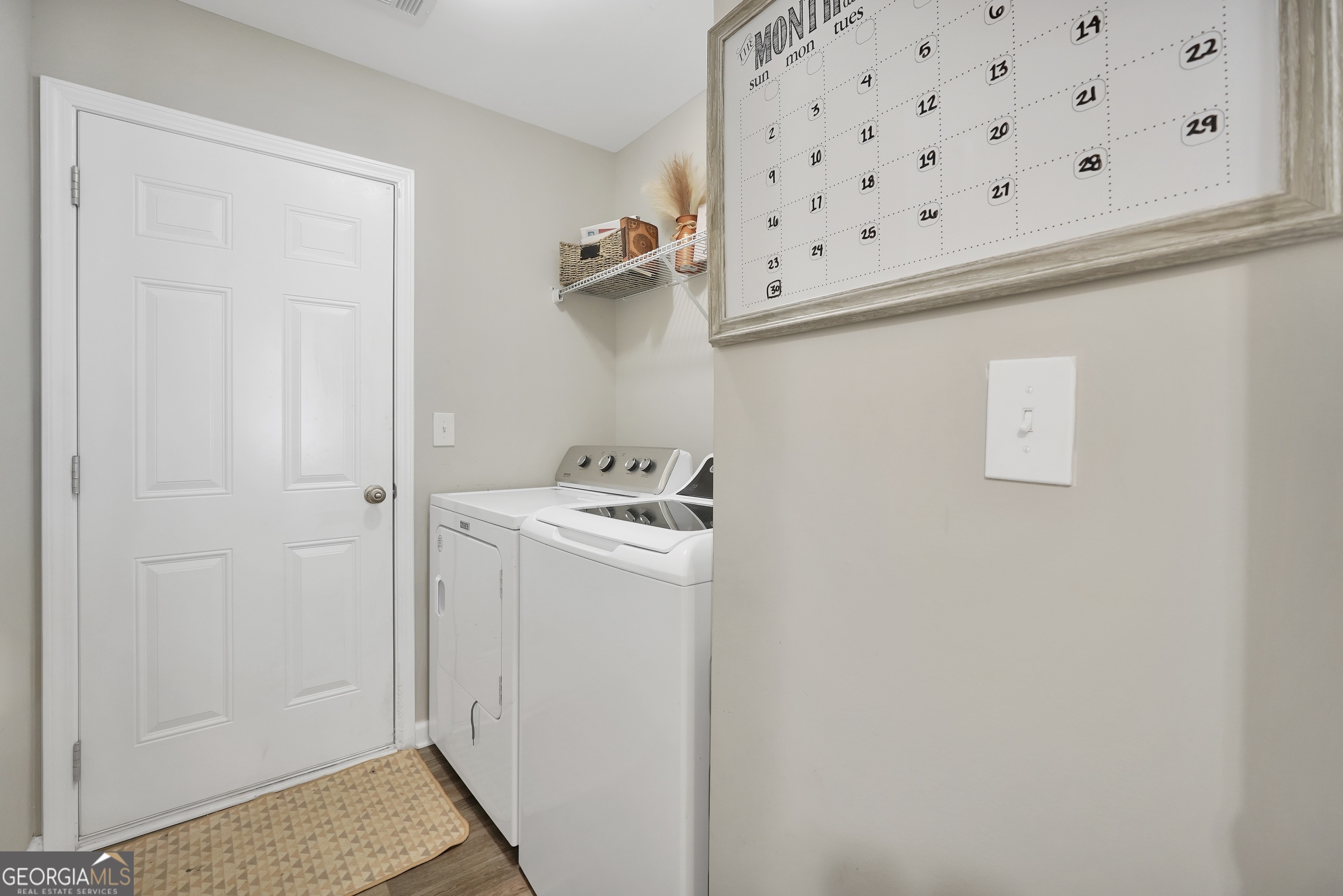 129 Magnolia Trail Milner, GA 30257 - Photo 13 of 29 a view of a hallway with washer and dryer