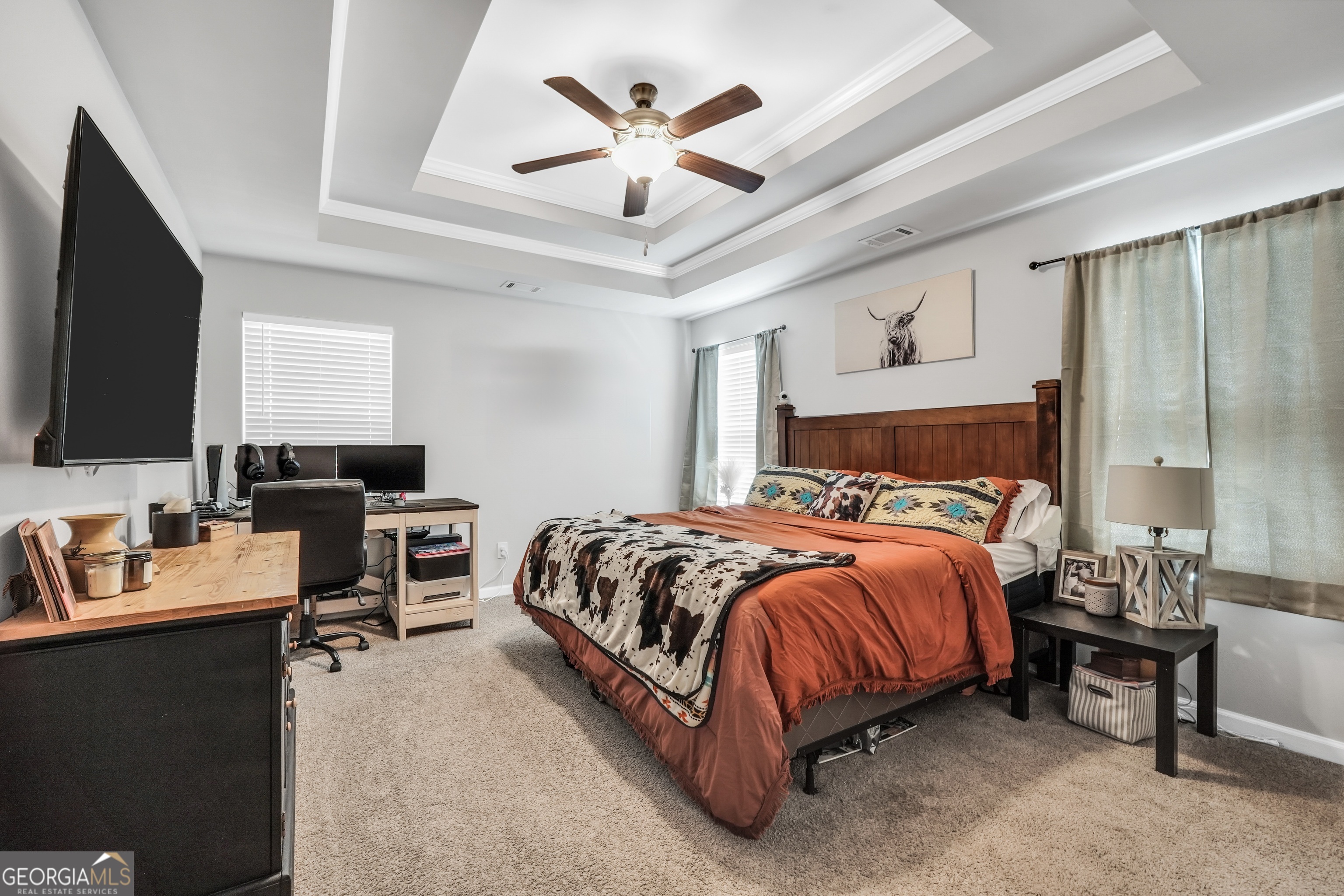 129 Magnolia Trail Milner, GA 30257 - Photo 15 of 29 a bedroom with a bed and a chandelier