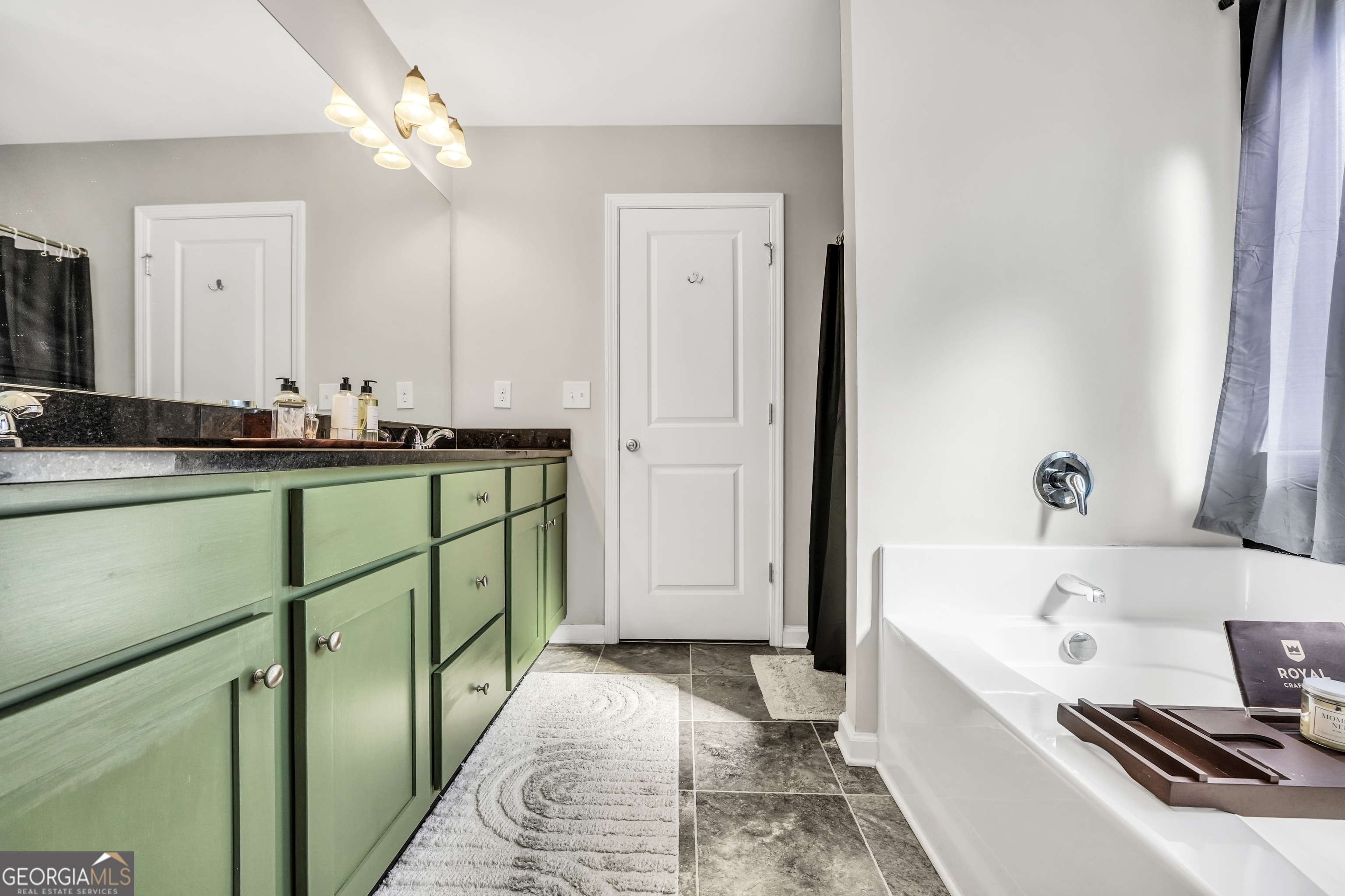 129 Magnolia Trail Milner, GA 30257 - Photo 17 of 29 a bathroom with a sink and a bathtub