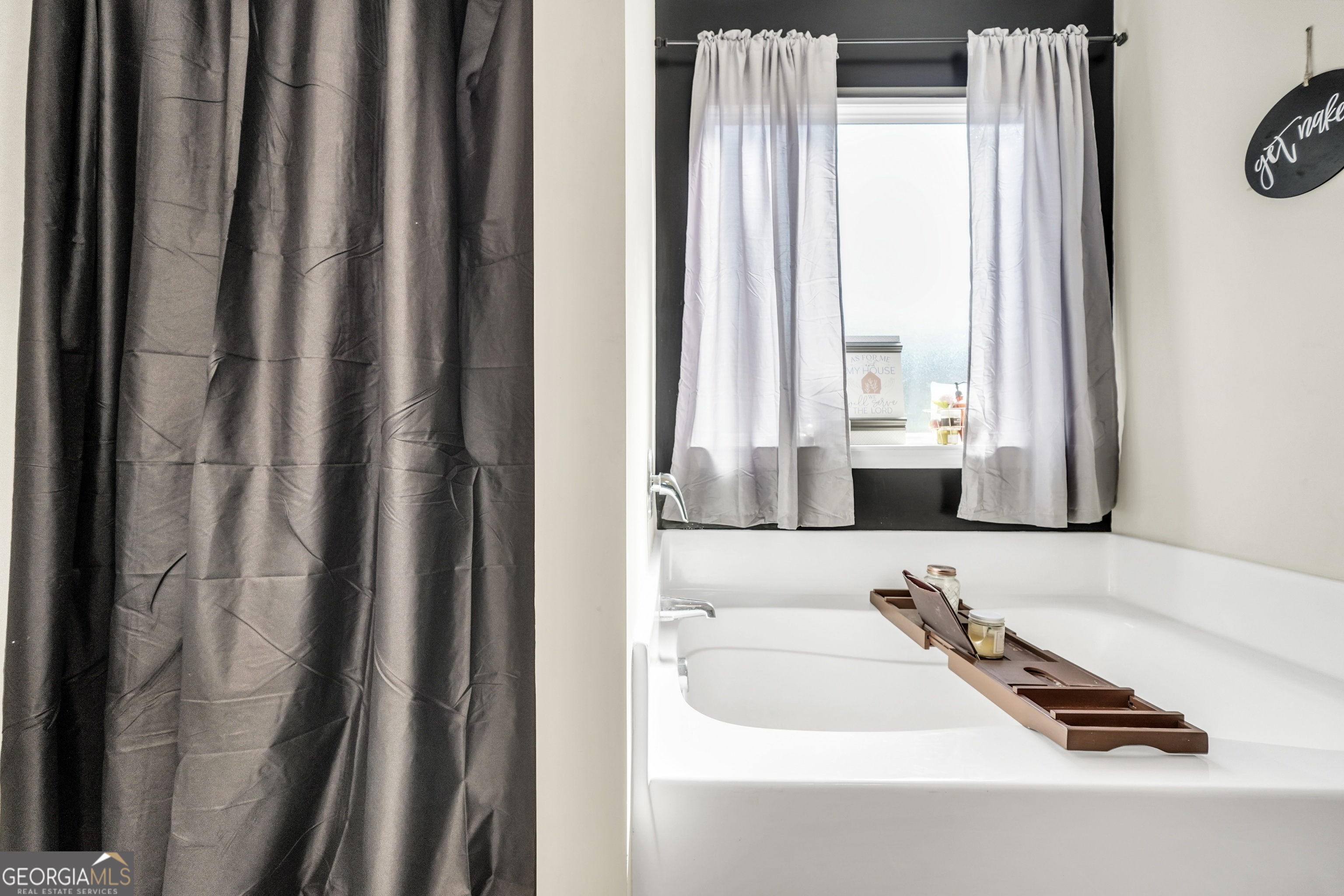 129 Magnolia Trail Milner, GA 30257 - Photo 19 of 29 a bathroom with a tub and a sink