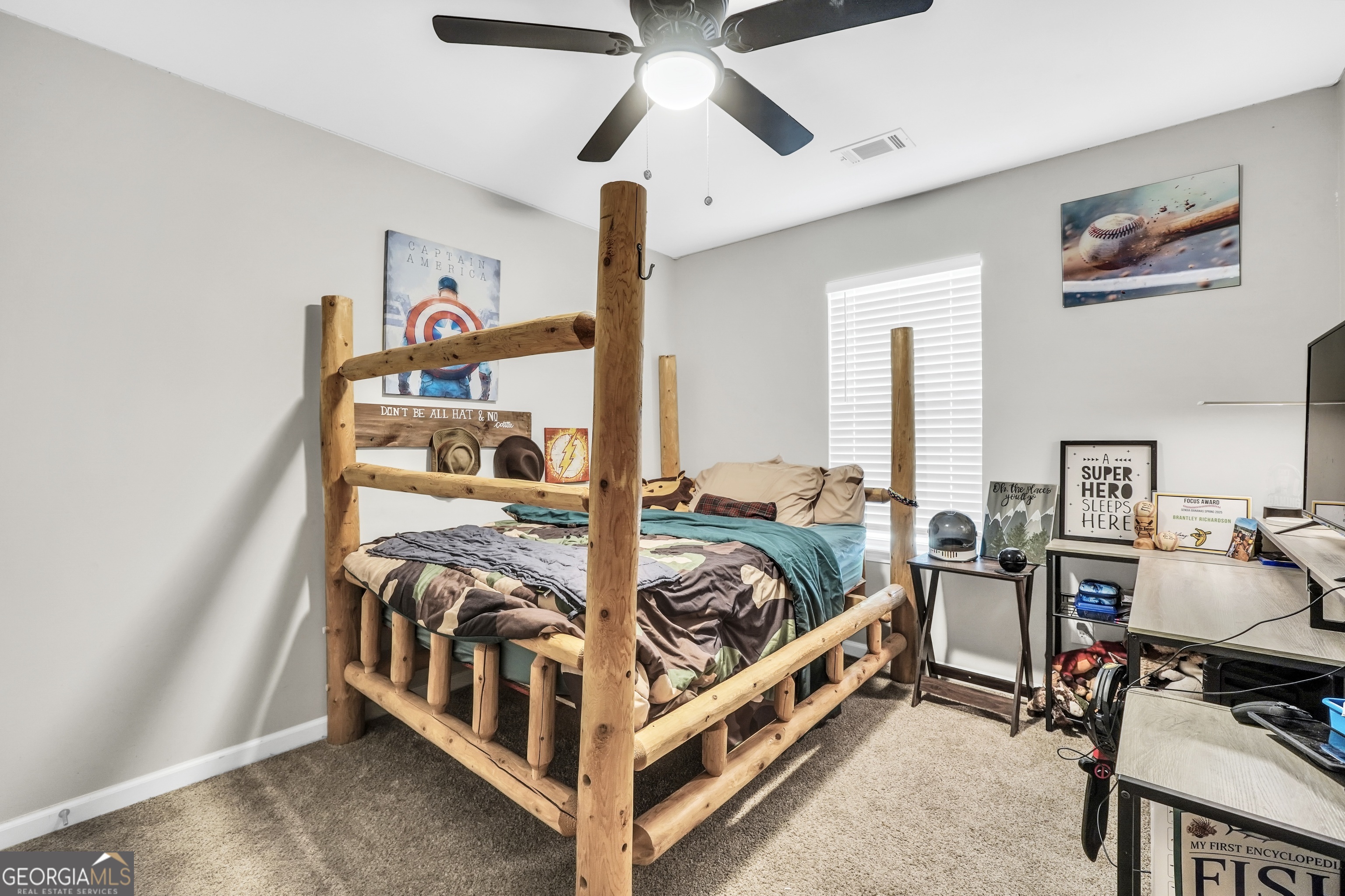 129 Magnolia Trail Milner, GA 30257 - Photo 23 of 29 a bed room with furniture and a chandelier