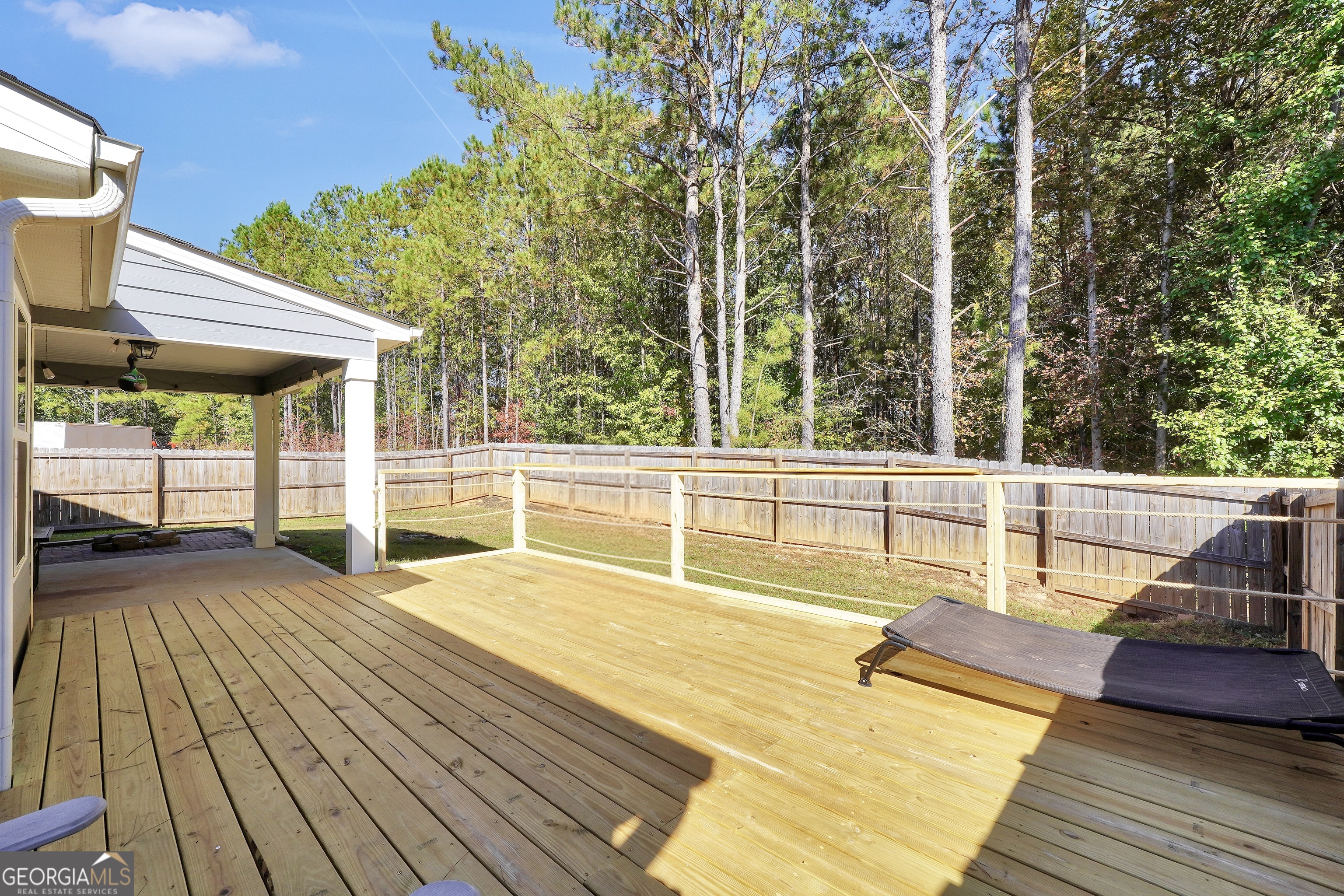 129 Magnolia Trail Milner, GA 30257 - Photo 24 of 29 a view of a patio with swimming pool